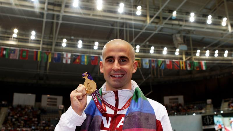 Benoit Huot posing with medal