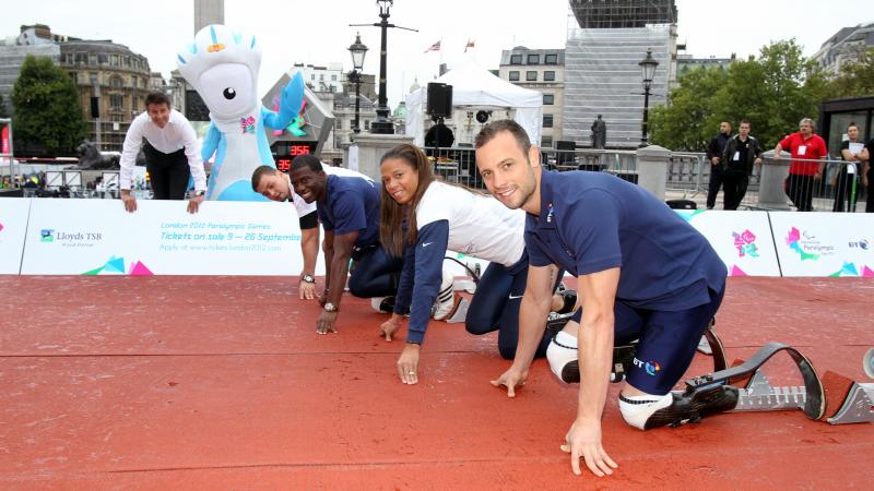 Oscar Pistorius (RSA), April Holmes (USA), Jerome Singleton (USA) and Heinrich Popow (GER) preparing for a friendly 100m race during the 2011 International Paralympic Day in Trafalgar Square in London, Great Britain