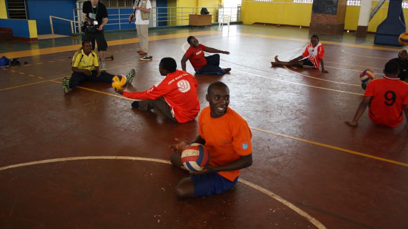 athletes practicing sitting volleyball