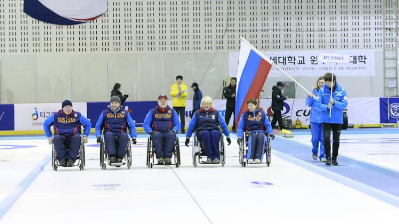 Gold winner Team Russia celebrating at the Medal Ceremony of the 2012 Wheelchair Curling World Championships in Chuncheon, Korea