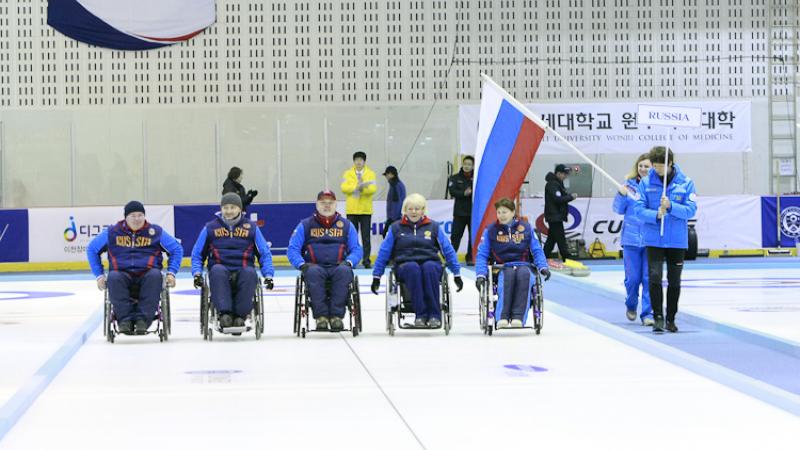 Gold winner Team Russia celebrating at the Medal Ceremony of the 2012 Wheelchair Curling World Championships in Chuncheon, Korea