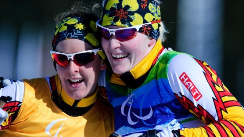 Courtney Knight posing with her guide Andrea Bundon at the 2012 Vancouver Paralympic Winter Games