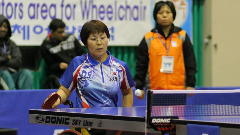 A Korean person is playing Table Tennis