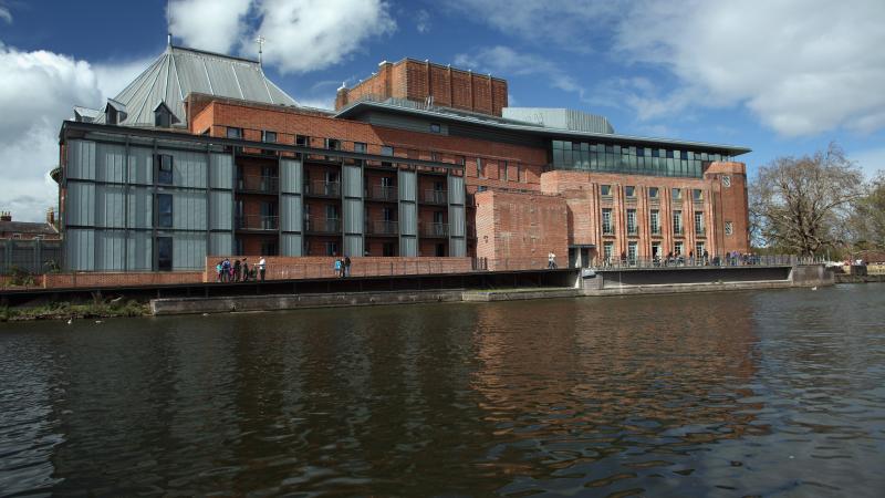 A picture of a building next to a river