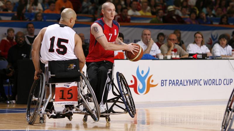 A picture of a person in a wheelchair playing basketball