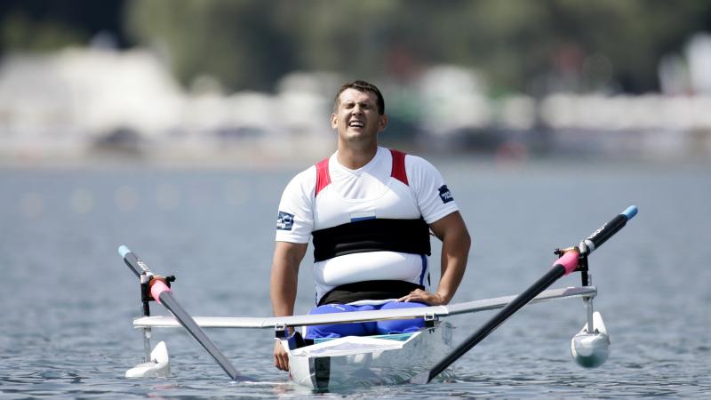 A picture of man in a boat affected by his effort