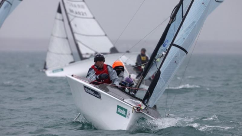 A picture of 2 person in a small boat