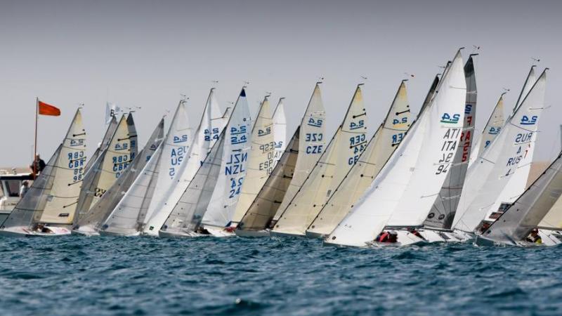 A group of 2.4mR boats lined up in a row