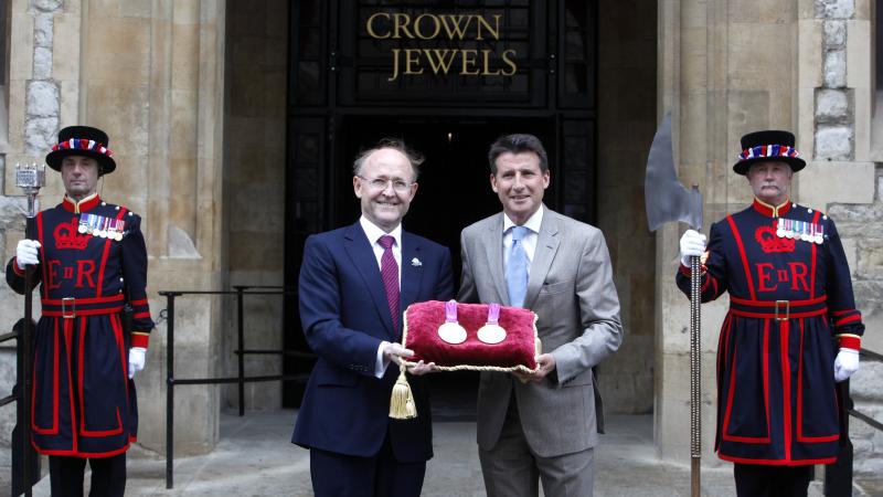 A picture of 2 men showing medals together