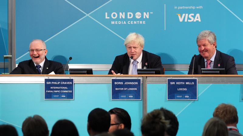 A picture of 3 person sit down together and discussing