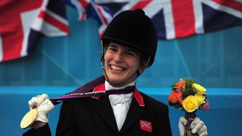 Sophie Christiansen holding gold medal