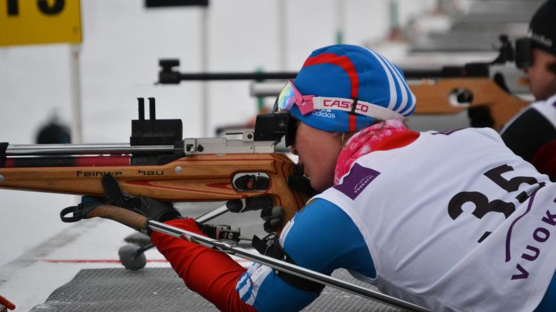 A picture of a woman shooting.