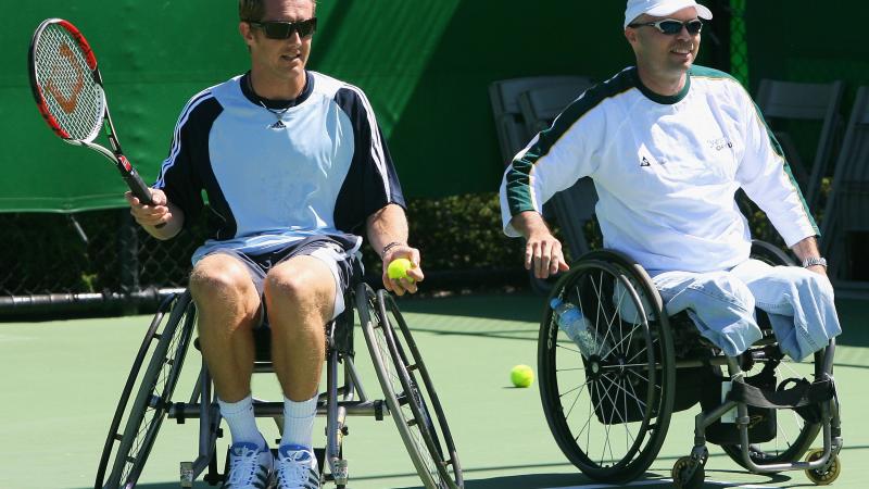 Wheelchair tennis legend David Hall (right) introduces Jonas Bjorkman to the sport (left)