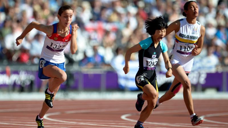 A picture of 3 women running in an athletics race