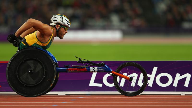 A picture of a man in a wheelchair racing during an athletics event