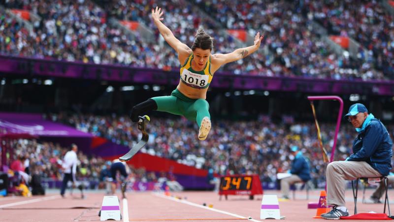 A picture of a woman with her body above the floor