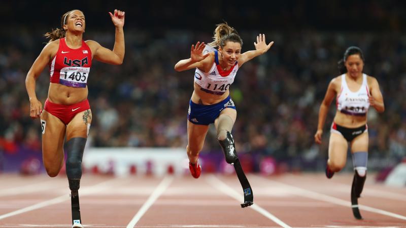 A picture of three women running on the track