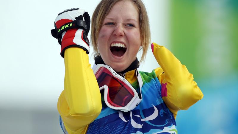 A picture of a woman celebrating her victory