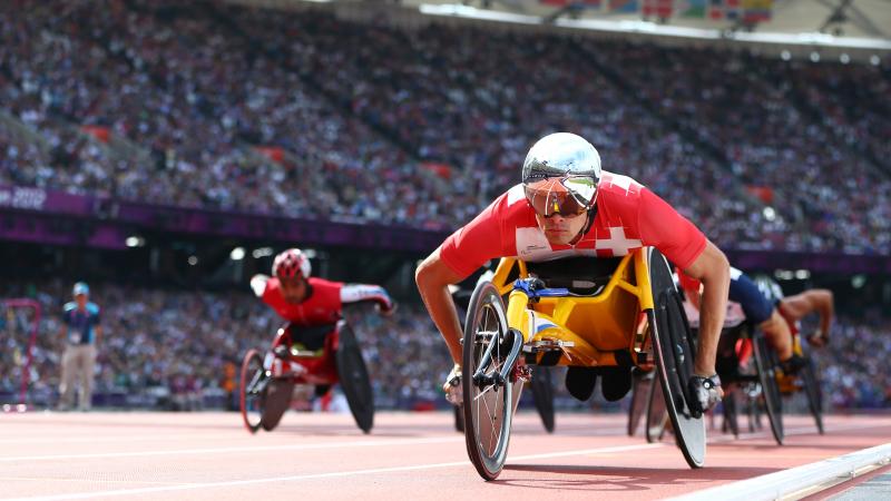 A picture of a man in a wheelchair on a track