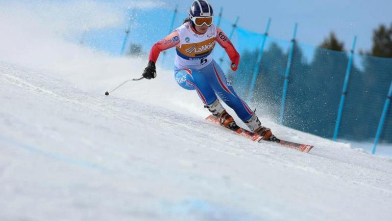 A picture of a woman skiing