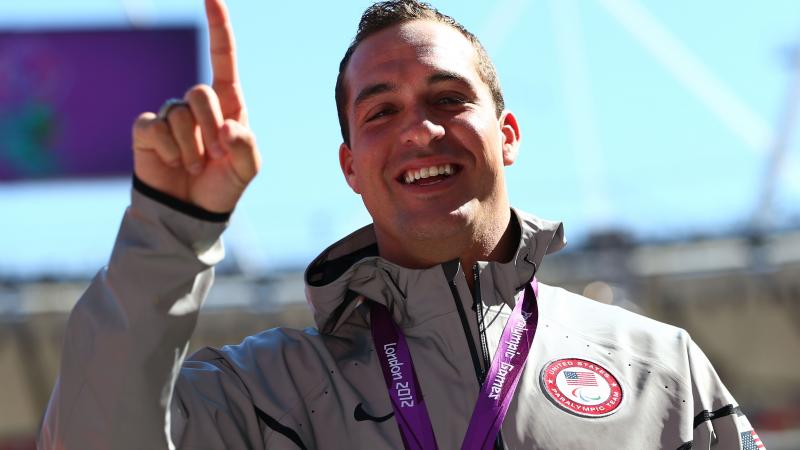 A picture of a man with a medal around his neck