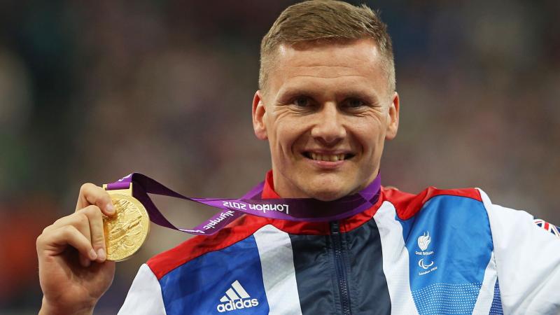 A picture of a man with a medal around his neck