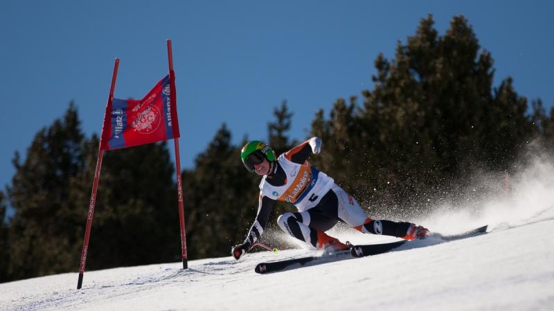 A picture of a woman skiing on the slopes