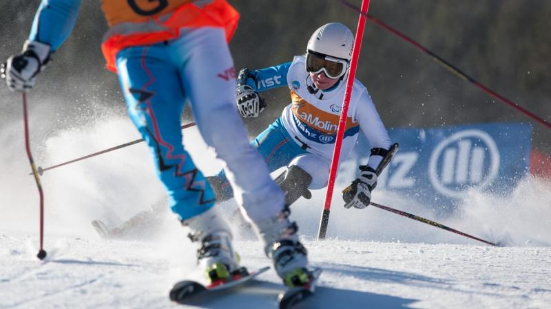 A picture of a woman skiing on the slopes