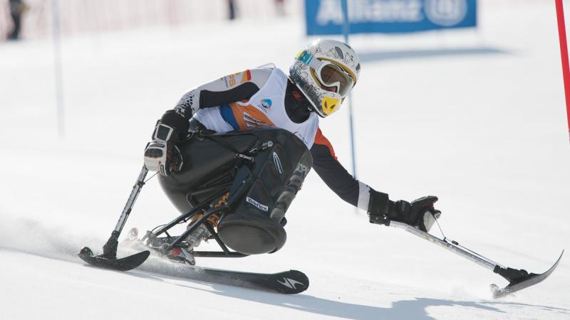 A picture of a woman skiing on the slopes