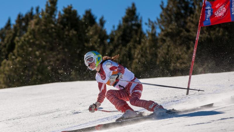 A picture of a woman skiing on the slopes