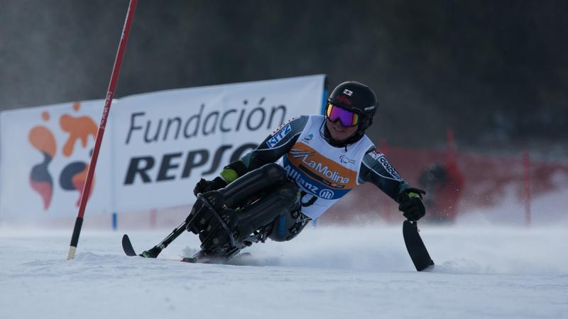 A picture of a man skiing on the slopes