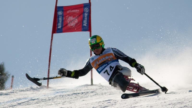 A picture of a man skiing on the slopes