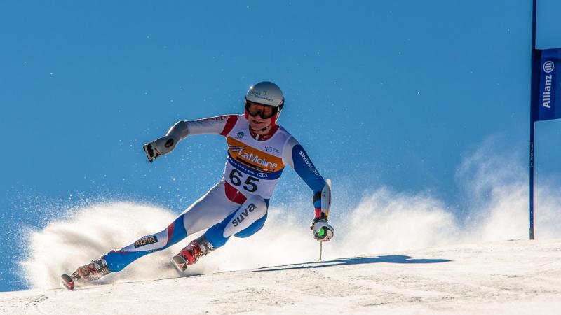 A picture of a man skiing on the slopes