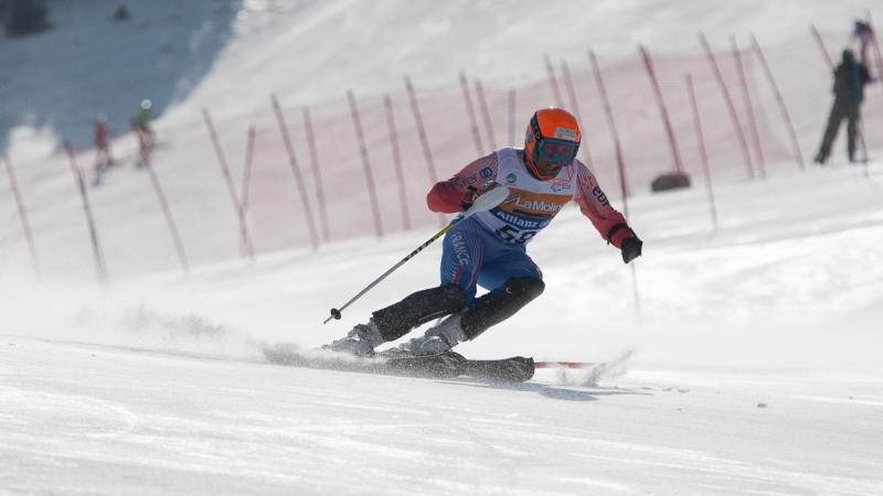 A picture of a man skiing on the slopes