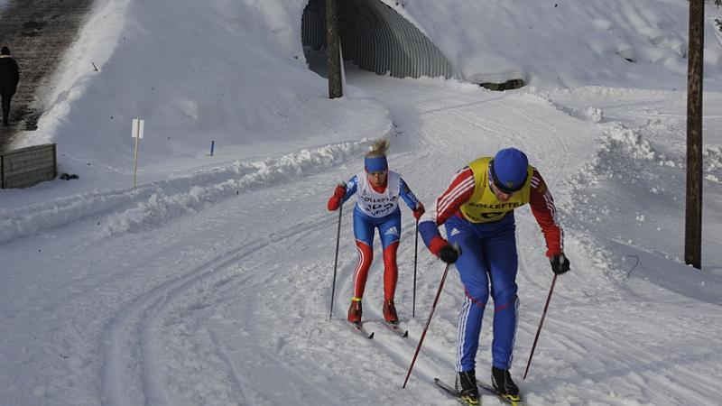 A picture of a woman skiing on a track