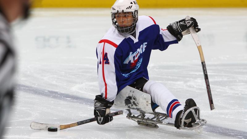 A picture of the ice sledge hockey player on the field