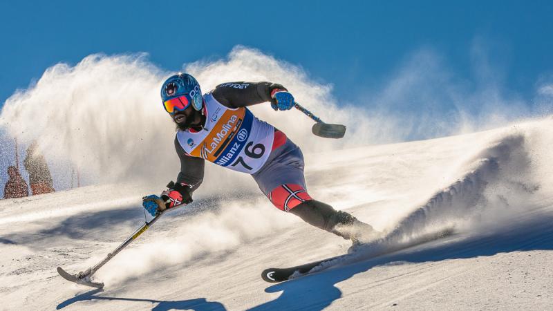 A picture of a man skiing on the slopes