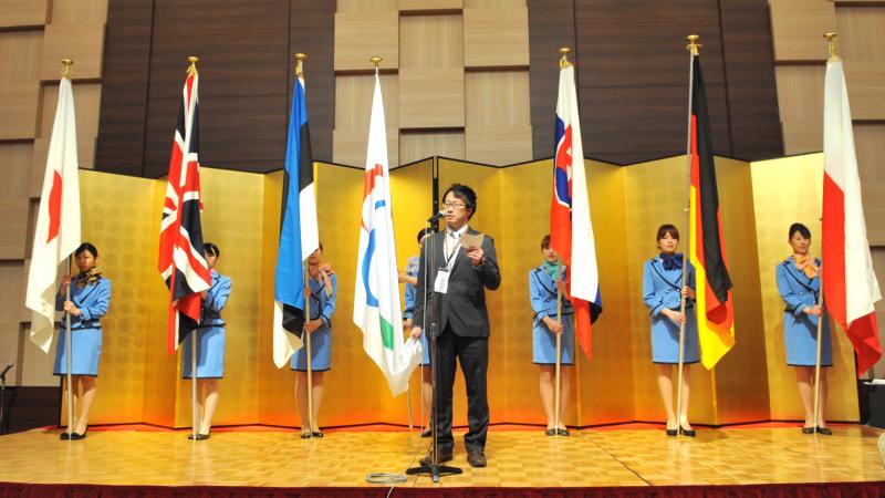 A picture of man talking during a speech