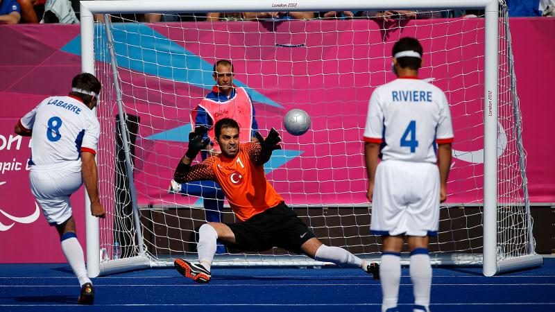 David Labarre of France scores a penalty against Ali Hidir Kurt of Turkey - Football 5-a-side