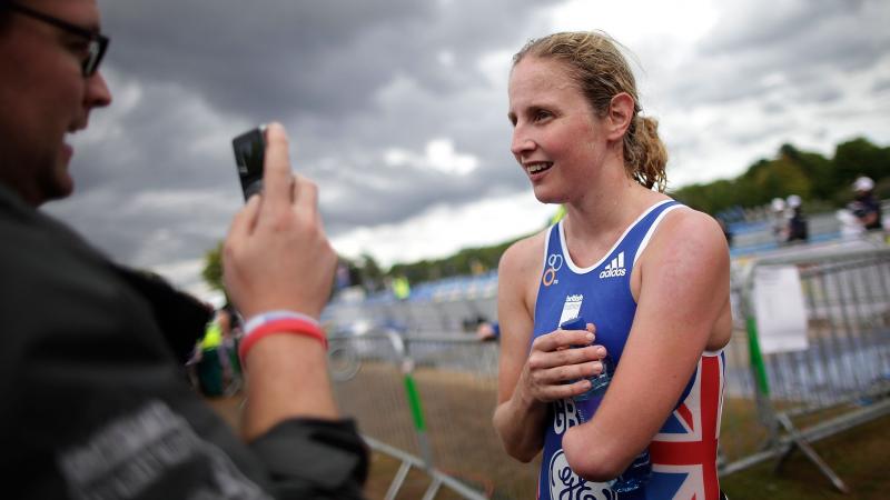 Para-triathlete Clare Cunningham of Great Britain talks to a journalist