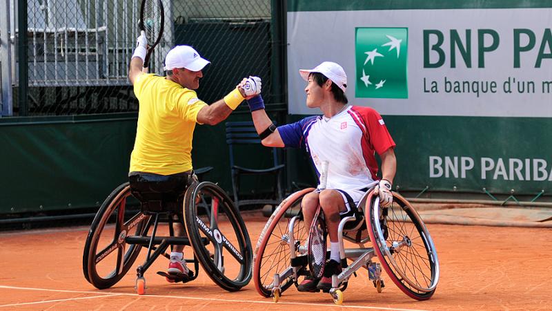 France's Stephane Houdet, left, defeated Shingo Kunieda for the 2013 Roland Garros men's singles titles, and just hours later partnered with him to win the doubles title. 