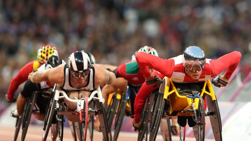 Marcel Hug of Switzerland (R) and Josh Cassidy of Canada compete in the Men's 5000m - T54 heats on day two of the London 2012 Paralympic Games at Olympic Stadium.