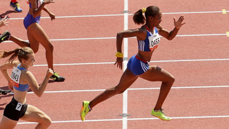 Mandy Francois-Elie sprinting on a tartan track leading the field.