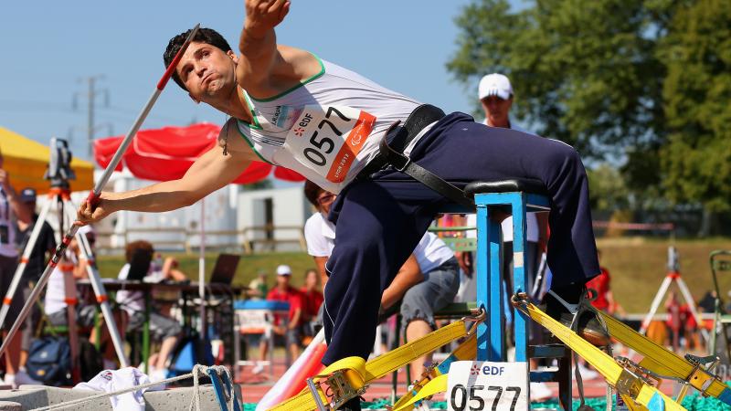 An athlete throws a javelin