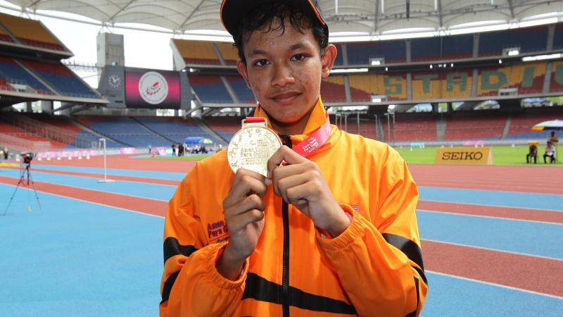 Fitri Ghani wins the first gold at the Athletics venue at the 2013 Asian Youth Para Games