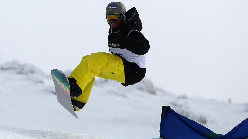 Keith Gabel of the United States of America competes in the Snowboard Cross Adaptive Standing Men