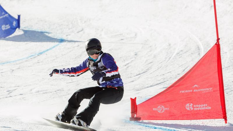 Heid-Jo Duce on her snowboard at a slalom event. 