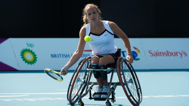 Athlete in a competition of wheelchair tennis.