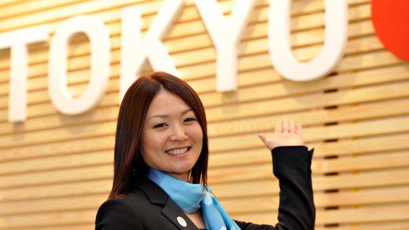 A woman speaks at a podium.