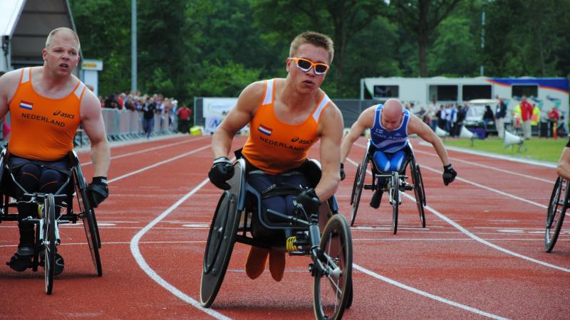 Wheelchair racer crosses the finish line